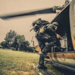 Soldier boarding a helicopter during field operation