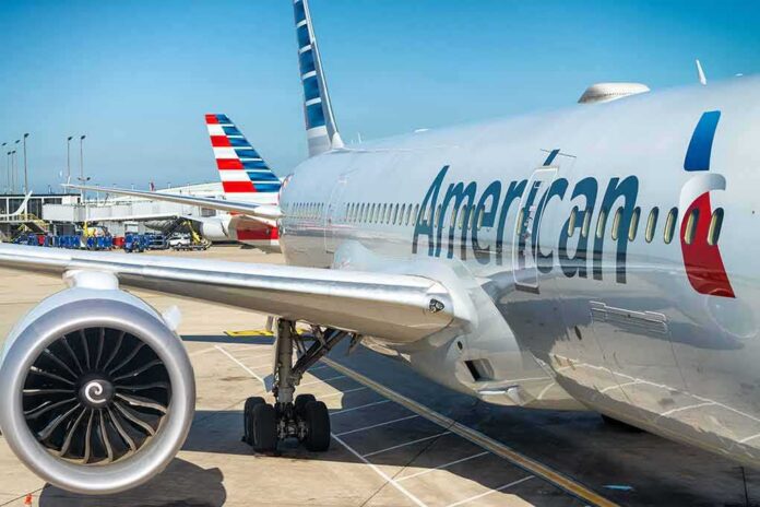 Commercial airplane at airport gate with engine and fuselage visible