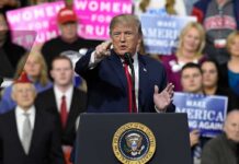 Massive Crowd, Bigger Bet – What’s Next? politician speaking at a rally podium