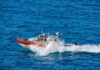 coast guard patrol boat speeding across open ocean