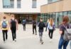 One School’s Rejection Just Hit A Constitutional Wall Students with backpacks walking toward a school entrance