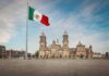 Foreign Loyalty Uproar Jolts NYC Race Mexican flag over a historic cathedral in a large city square
