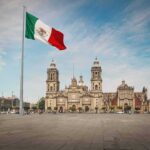 Foreign Loyalty Uproar Jolts NYC Race Mexican flag over a historic cathedral in a large city square