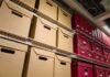 The Pentagon’s Vault Just Got Much Stranger Shelves filled with brown and red storage boxes for organizing documents