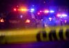 Bronx Field Meltdown – Head Slashed, Manhunt Police cars with flashing lights behind yellow caution tape at night