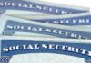 Social Security cards stacked in a close-up view