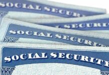 Americans’ SSNs Hijacked For Paychecks Social Security cards stacked in a close-up view