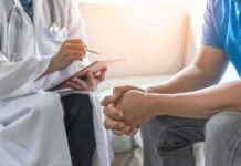 Cancer Shadow From Ground Zero Work Doctor consulting a patient on a sofa