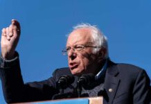 A Historic Antiwar Stage Returns to Spotlight Bernie Sanders speaking at a podium outdoors
