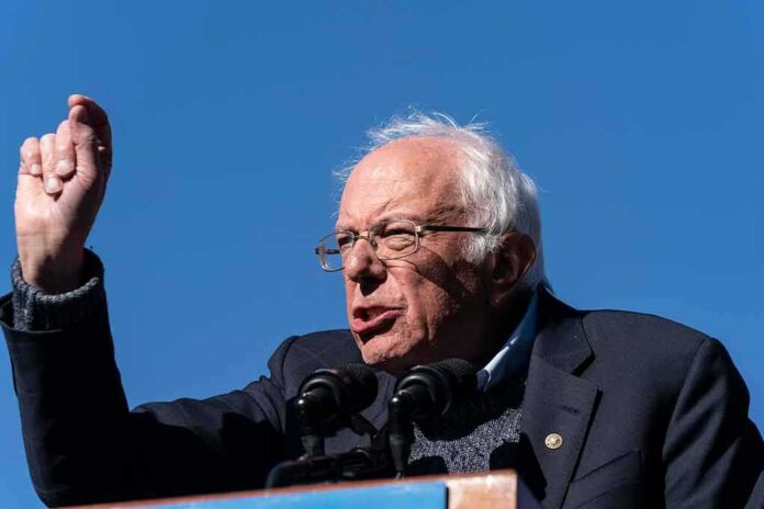Bernie Sanders speaking at a podium outdoors
