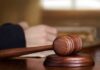 Wooden judge's gavel on sound block