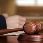 Wooden judge's gavel on sound block