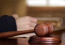 Wooden judge's gavel on sound block