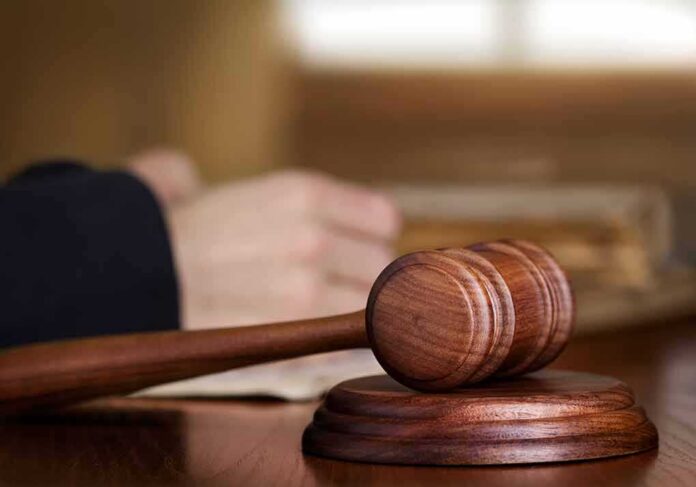Wooden judge's gavel on sound block