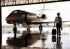Two Alarming Findings Emerge From One Flight Pilot walking with suitcase beside private jet in hangar