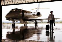 Two Alarming Findings Emerge From One Flight Pilot walking with suitcase beside private jet in hangar
