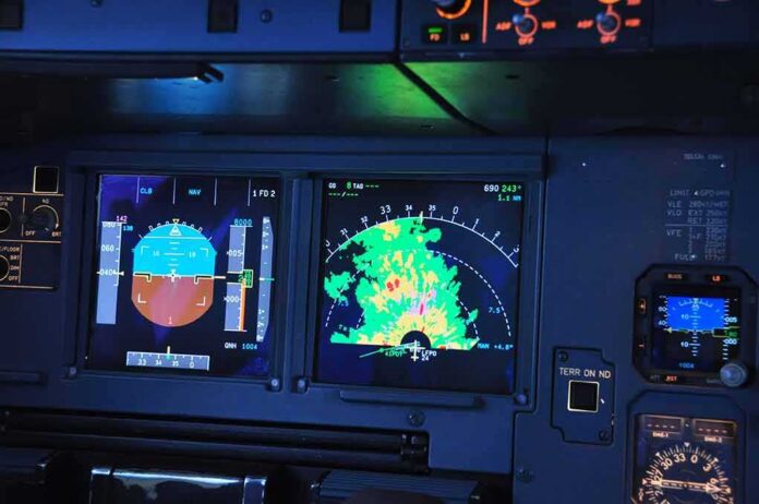 shutterstock_1588491106 aircraft cockpit displays with attitude indicator and weather radar