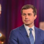Pete Buttigieg in a blue suit during an interview