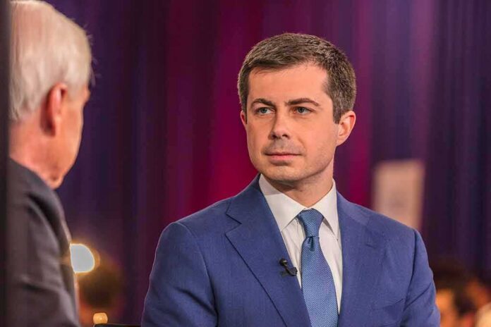 shutterstock_1657004440 Pete Buttigieg in a blue suit during an interview