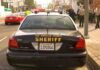 Sheriff patrol car parked on city street