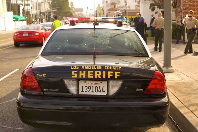 shutterstock_1664860999 Sheriff patrol car parked on city street