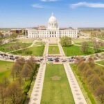 State capitol building with dome and surrounding lawns