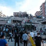 War-Torn Gaza: Eid Marked by Suffering Rescue workers and civilians on collapsed building after earthquake