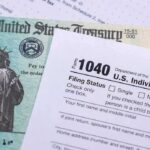U.S. tax form 1040 beside a Treasury check