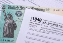 Millions Of Americans Got A Bigger Tax Surprise U.S. tax form 1040 beside a Treasury check