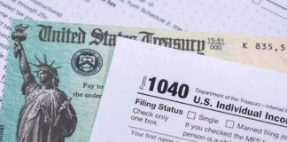 U.S. tax form 1040 beside a Treasury check