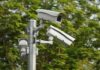 surveillance cameras mounted on a metal pole