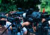 Miami Steakhouse Boss: Brutal Tower Allegations TV news cameras crowding together at an outdoor event