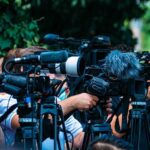 Washington Paper Mill Horror: Nine Workers Missing TV news cameras crowding together at an outdoor event