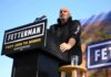 Children’s Hospital Brushed Off—Why? Speaker at outdoor rally standing at podium with microphone