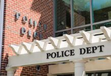 Judge Hammers Suspect – Internet Cut, Huge Bond Police department entrance with pergola and brick wall