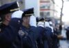Thousands of Police Tickets Died on Paper uniformed police officers salute in formation outdoors