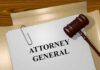 judge's gavel beside attorney general document on desk