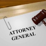 judge's gavel beside attorney general document on desk