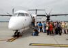 Deportees Refuse to Deplane, But Removal Continues Passengers boarding a white turboprop airplane on the tarmac