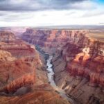 Grand Canyon with river winding through layered red cliffs