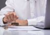Person stamping an approved mark on a document