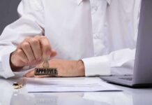 Person stamping an approved mark on a document