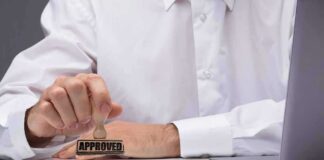Person stamping an approved mark on a document