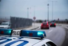 A High-Tech Policing Tool Faces Growing Public Resistance Police car with blue lights on near a roadway