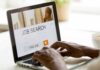 The Unemployment Rate Isn’t Telling the Whole Story Hands typing on laptop with job search website open