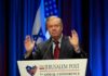 Big Money Floods SC – Panic Or Power Play? Lindsey Graham speaking at a podium with hands raised