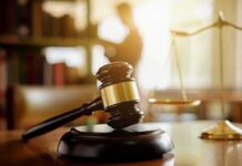 Viewpoint Discrimination EXPLODES In Court Judge's gavel on a desk with scales of justice in background
