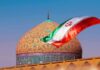 Hormuz Brink: Qatar’s High-Stakes Play Iranian flag waves before an ornate mosque dome at sunset