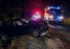 A Walk Together Ends In Double Heartbreak Crashed car on a dark roadside with emergency vehicles