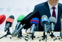 Brazil’s Shock Call: Lula Over Bolsonaro microphones clustered on a table at a press conference